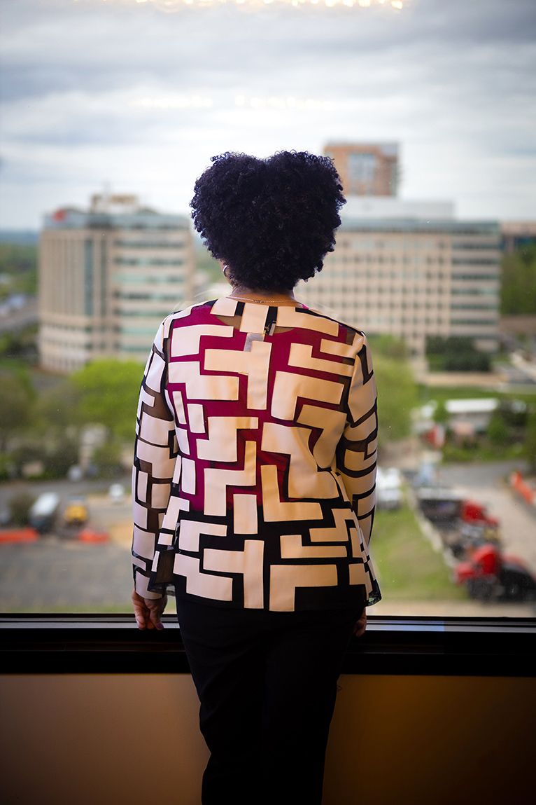 Brenda looking at cityscape.